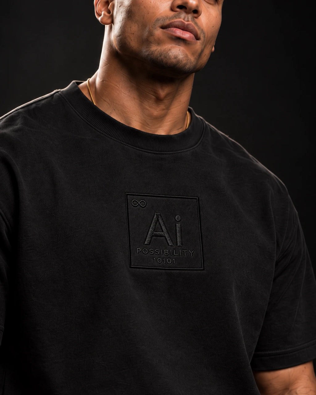 Close-up of the embroidered Ai + You element tile on the chest of the Possibility Box Tee