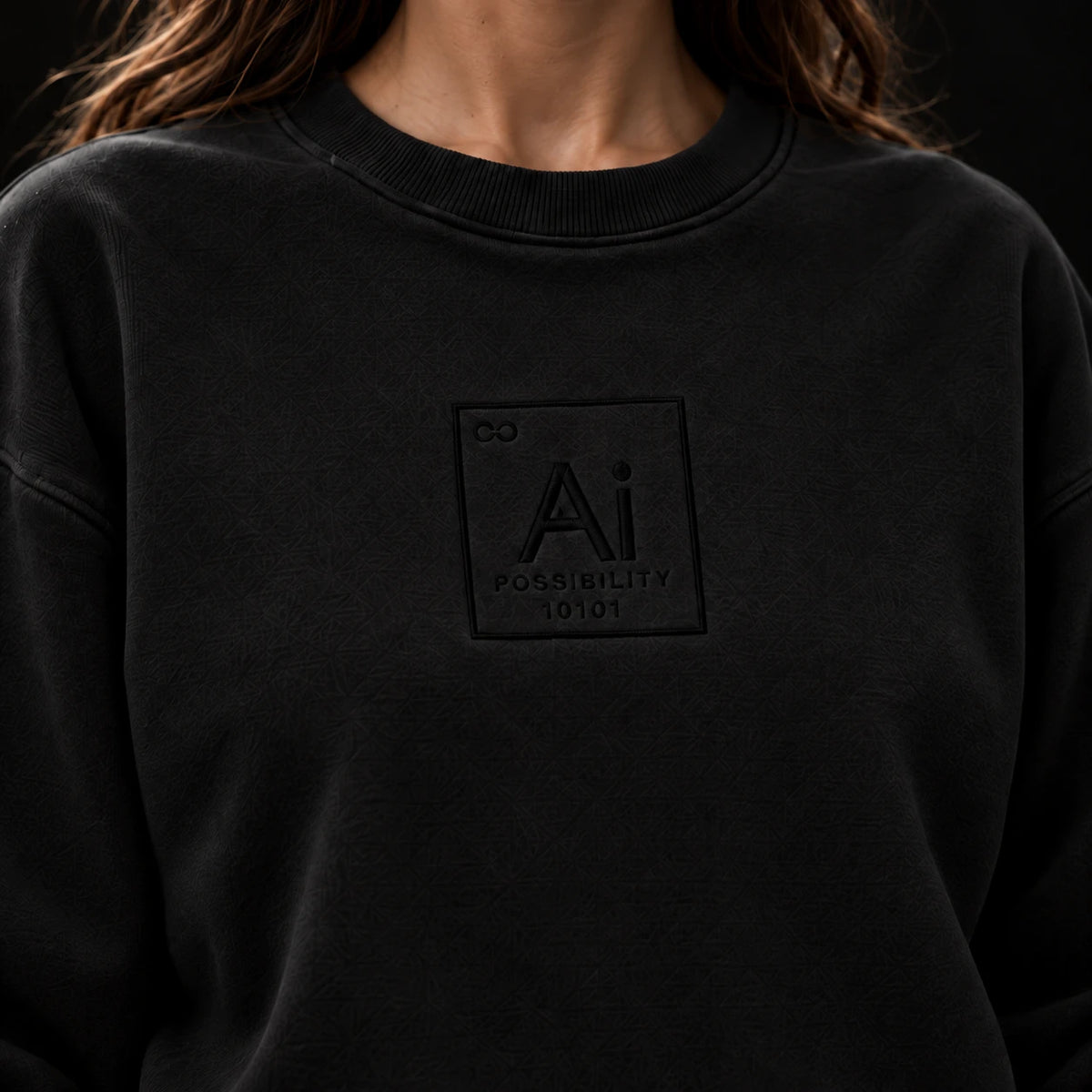 Close-up of the tone-on-tone Ai element mark on the chest