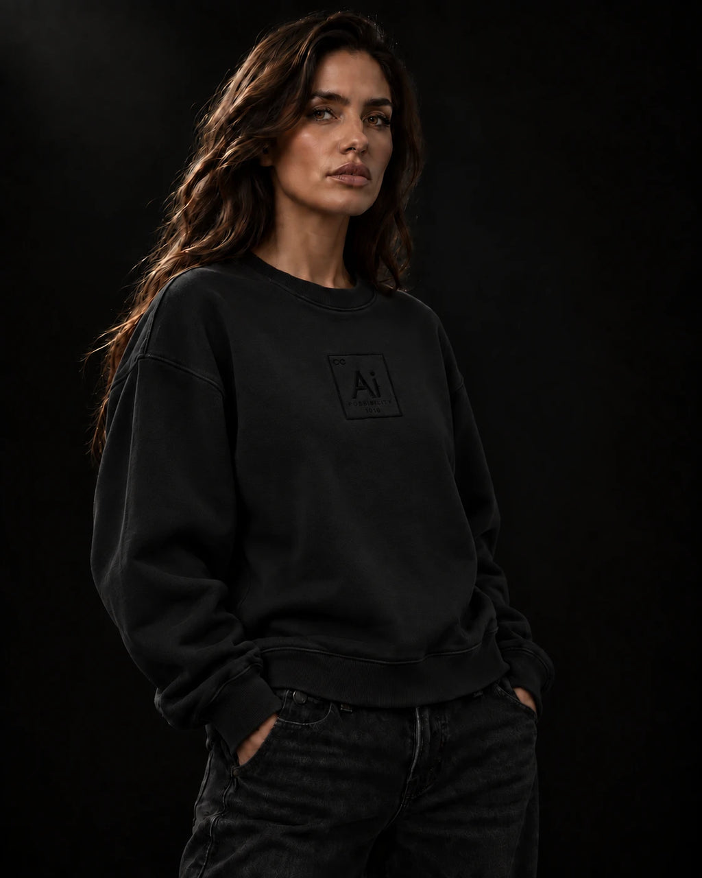 Model wearing the Ai + You Possibility Crewneck in washed black against a dark studio backdrop