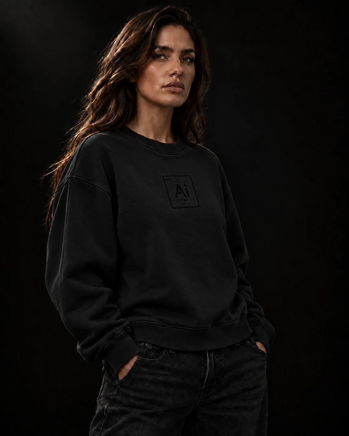 Model wearing the Ai + You Possibility Crewneck in washed black against a dark studio backdrop