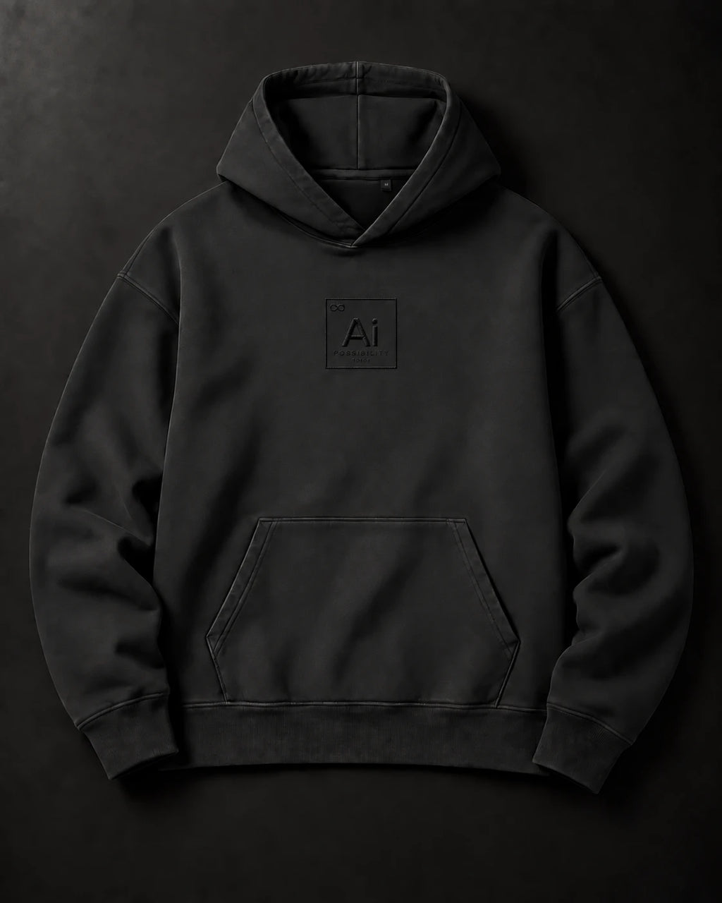 The Possibility Hoodie laid flat on a charcoal surface