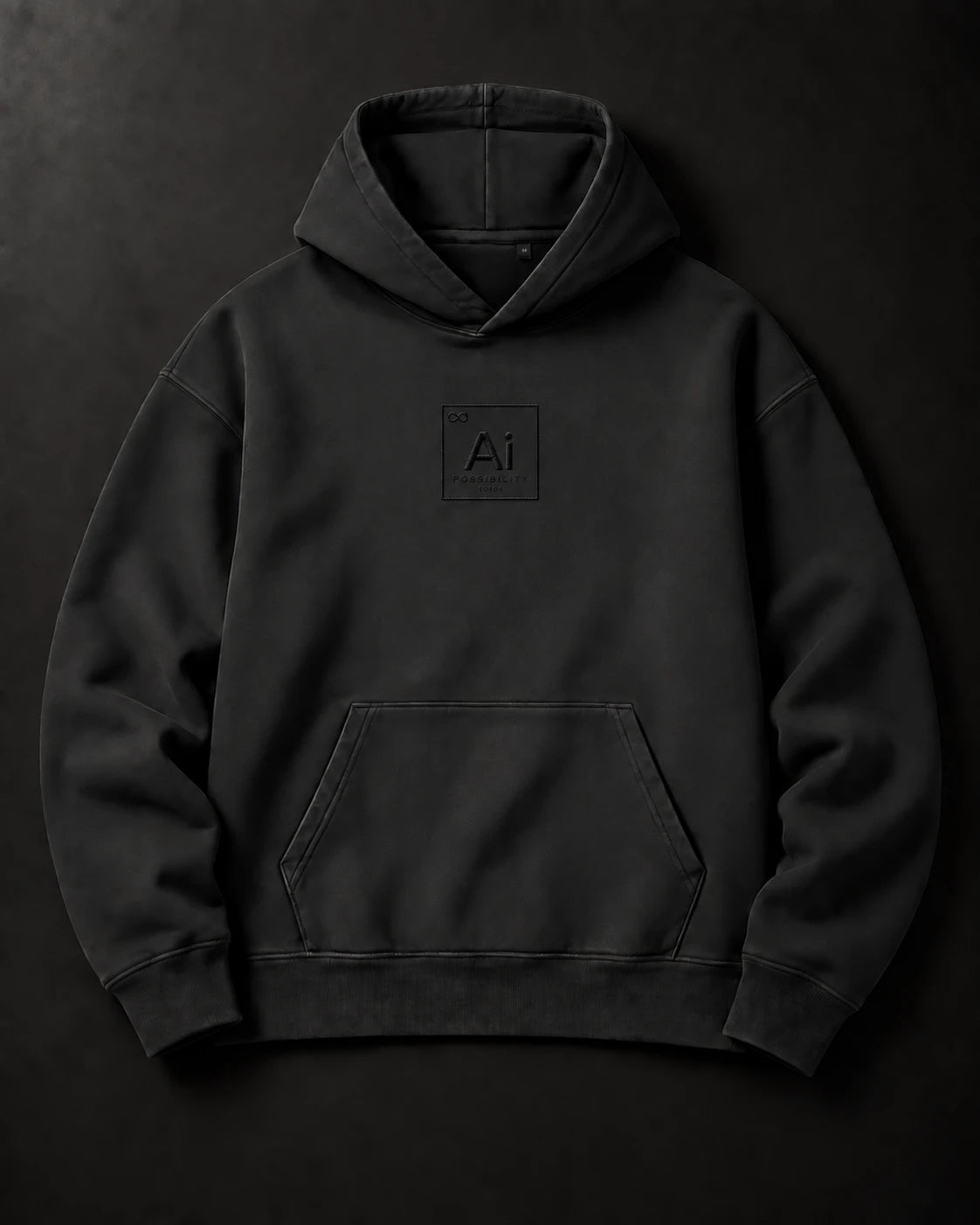 The Possibility Hoodie laid flat on a charcoal surface